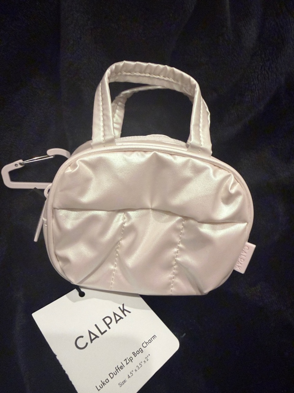 New with tag Calpak Luka Duffel Zip Bag Charm in Pearlescent